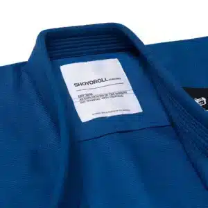 Close view of Shoyoroll FC Kimono Blue collar with label “Kimono Dev 2050 Modern Martial Arts Uniform”