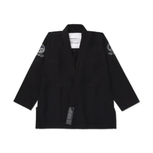 Spiral Kimono black jacket front showing bottom label reading “Shoyoroll brand est.2000/origin: Six7one Guam” in clean detail.